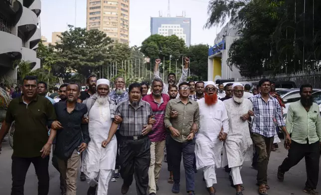 Bangladesh Nationalist Party activists shout slogans during a protest to counter former prime minister Sheikh Hassan's Awami League party rally in Dhaka, Bangladesh, Sunday, Nov. 10, 2024. (AP Photo/Mahmud Hossain Opu)