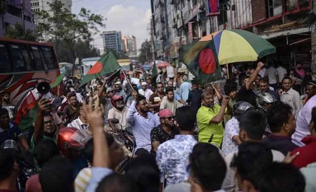 Bangladesh Nationalist Party activists shout slogans near prime minister Sheikh Hassan's Awami League party office in Dhaka, Bangladesh, Sunday, Nov. 10, 2024. (AP Photo/Mahmud Hossain Opu)