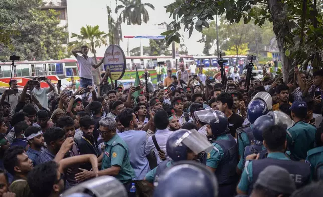 Policemen try to stop Bangladesh Nationalist Party activists marching near prime minister Sheikh Hassan's Awami League party office in Dhaka, Bangladesh, Sunday, Nov. 10, 2024. (AP Photo/Mahmud Hossain Opu)