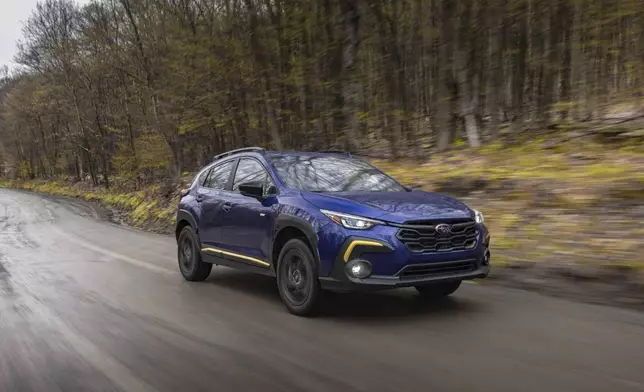 This photo provided by Subaru shows the 2025 Crosstrek. The Crosstrek's outdoorsy design also works well for driving in the urban jungle. (Courtesy of Subaru of North America via AP).