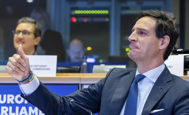 Netherland's Wopke Hoekstra, nominee for European Commissioner for Climate, Net-Zero and Clean Growth, gestures prior to making his opening address during a confirmation hearing at the European Parliament in Brussels on Thursday, Nov. 7, 2024. (AP Photo/Geert Vanden Wijngaert)