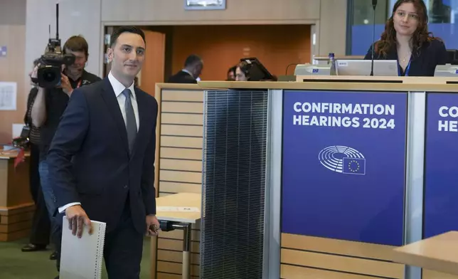 Malta's Glenn Micallef, candidate for EU Commissioner for Intergenerational Fairness, Youth, Culture and Sport, arrives for his hearing at the European Parliament in Brussels, Belgium, on Monday, Nov. 4, 2024. (AP Photo/Virginia Mayo)