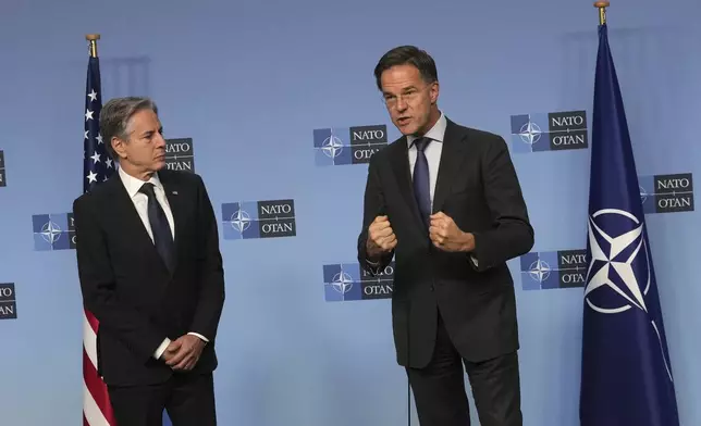 NATO Secretary General Mark Rutte, right, delivers a statement with United States Secretary of State Antony Blinken prior to a meeting at NATO headquarters in Brussels on Wednesday, Nov. 13, 2024. (AP Photo/Virginia Mayo)