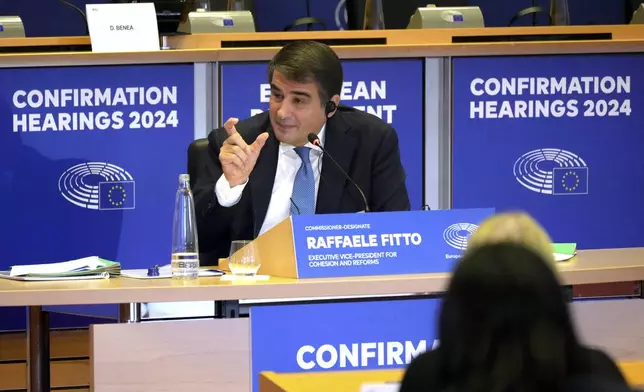 Italy's Raffaele Fitto, nominee for European Commissioner Executive Vice-President for Cohesion and Reforms, speaks during his hearing at the European Parliament in Brussels on Tuesday, Nov. 12, 2024. (AP Photo/Virginia Mayo)