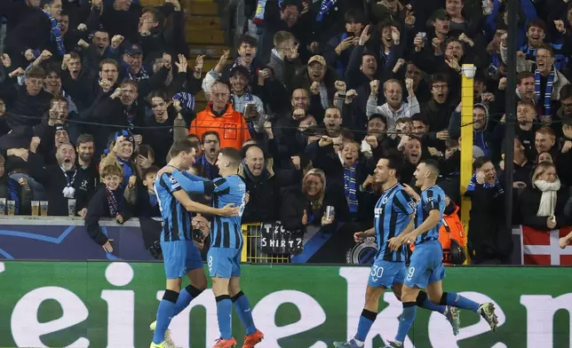 Brugge's Hans Vanaken, left, celebrates with teammates after scoring a penalty his side's first goal, during the Champions League opening phase soccer match between Club Brugge and Aston Villa at Jan Breydelstadion in Bruges, Belgium, Wednesday, Nov. 6, 2024. (AP Photo/Geert Vanden Wijngaert)