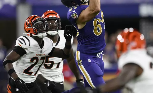 Baltimore Ravens tight end Mark Andrews (89) catches a pass against Cincinnati Bengals safety Jordan Battle (27) during the first half of an NFL football game, Thursday, Nov. 7, 2024, in Baltimore. (AP Photo/Nick Wass)