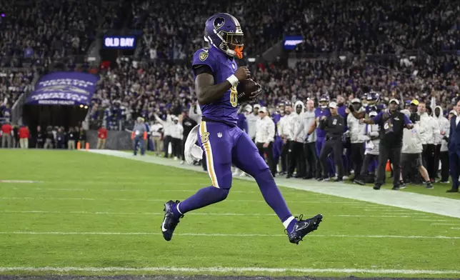 Baltimore Ravens quarterback Lamar Jackson scores a two-point conversion during the second half of an NFL football game against the Cincinnati Bengals, Thursday, Nov. 7, 2024, in Baltimore. (AP Photo/Nick Wass)