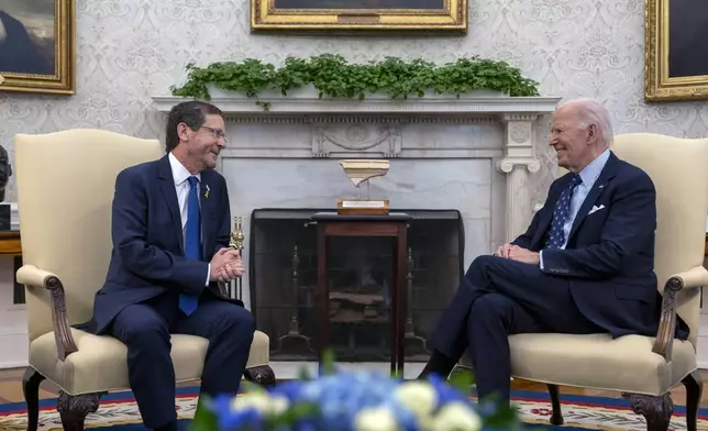 President Joe Biden meets with Israel's President Isaac Herzog, left, in the Oval Office of the White House in Washington, Tuesday, Nov. 12, 2024. (AP Photo/Ben Curtis)