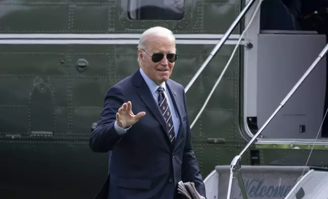 President Joe Biden walks from Marine One as he arrives on the South Lawn of the White House in Washington, Monday, Nov. 4, 2024. (AP Photo/Ben Curtis)