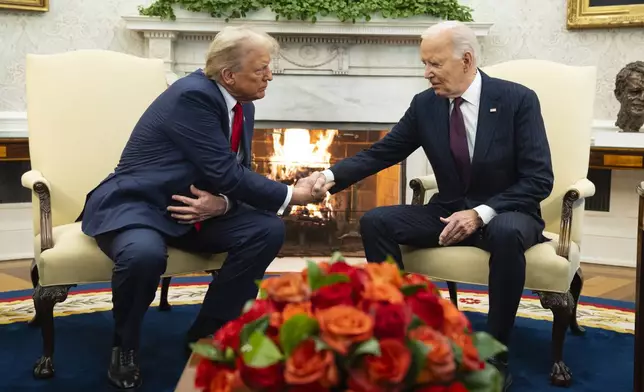 President Joe Biden meets with President-elect Donald Trump in the Oval Office of the White House, Wednesday, Nov. 13, 2024, in Washington. (AP Photo/Evan Vucci)