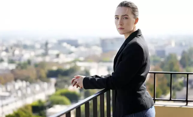 Saoirse Ronan, a cast member in "Blitz," poses for a portrait at the Four Seasons Hotel, Monday, Oct. 14, 2024, in Los Angeles. (AP Photo/Chris Pizzello)