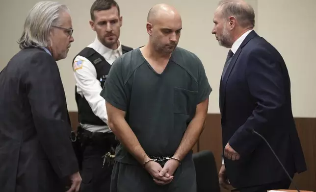 Sean M. Higgins, the driver charged with killing NHL hockey player Johnny Gaudreau and his brother Matthew as they bicycled on a rural road, is flanked by his layers, Matthew Portella, left, and Richard Klineburger, right, at the Salem County, N.J., Courthouse, Tuesday, Nov. 12, 2024, in Salem, N.J. (AP Photo/Matt Slocum)