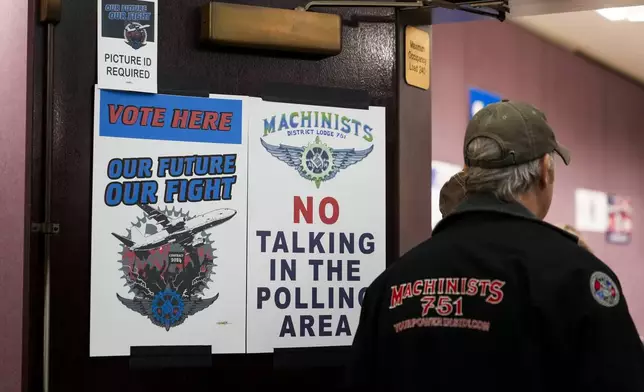 A worker watches as volunteers tally votes on a new contract offer from Boeing, Monday, Nov. 4, 2024, at IAM District 751 Union Hall in Seattle. (AP Photo/Lindsey Wasson)