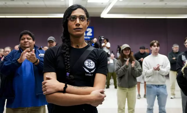 Eep Bolaño listens as IAM District 751 president Jon Holden announces that the union voted to accept a new contract offer from Boeing, Monday, Nov. 4, 2024, at their union hall in Seattle. (AP Photo/Lindsey Wasson)