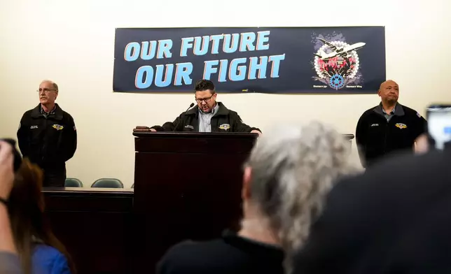 IAM District 751 president Jon Holden speaks to union members while announcing that they voted to accept a new contract offer from Boeing, Monday, Nov. 4, 2024, at their union Hall in Seattle. (AP Photo/Lindsey Wasson)