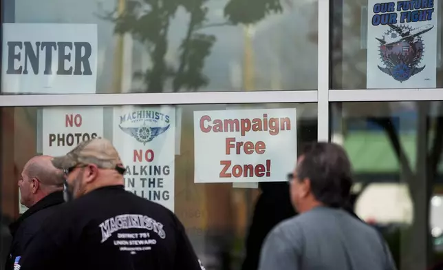 Boeing employees arrive to vote on a new contract offer from the company, Monday, Nov. 4, 2024, in Everett, Wash. (AP Photo/Lindsey Wasson)