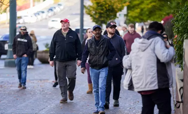 Boeing employees leave after voting on a new contract offer from the company, Monday, Nov. 4, 2024, outside the Angel of the Winds Arena in Everett, Wash. (AP Photo/Lindsey Wasson)