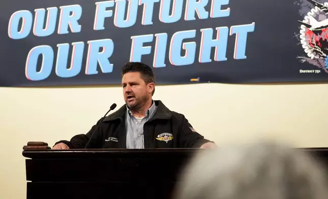 IAM District 751 president Jon Holden speaks to union members while announcing that they voted to accept a new contract offer from Boeing, Monday, Nov. 4, 2024, at their union Hall in Seattle. (AP Photo/Lindsey Wasson)