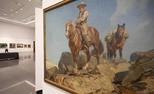 A painting that hangs at Heritage Auctions in Dallas, Thursday, Oct. 17, 2024, is just one of many works from the Boy Scouts of America's art collection — including some paintings by Norman Rockwell — that will go up for auction this month to help compensate tens of thousands of people, mainly men, who were sexually abused while in scouting. (AP Photo/Tony Gutierrez)