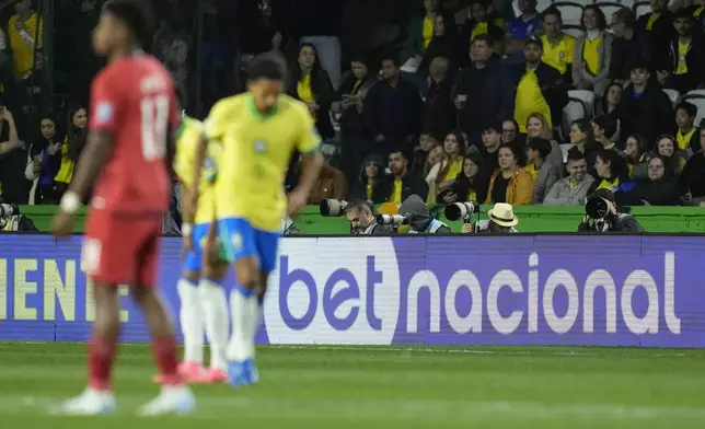 The stands at Couto Pereira Stadium display a betting company advertisement during a qualifying soccer match for the FIFA World Cup 2026 between Brazil and Ecuador in Curitiba, Parana state, Brazil, Friday, Sept. 6, 2024. (AP Photo/Silvia Izquierdo)