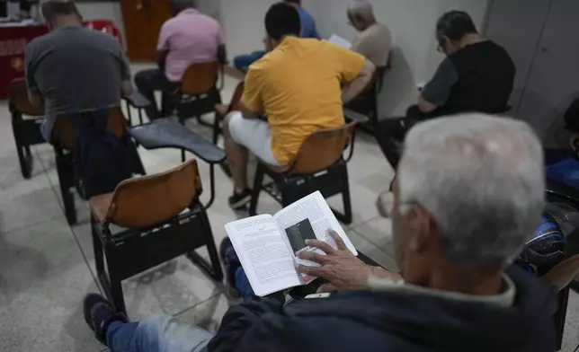 Gamblers in recovery attend a Gamblers Anonymous meeting in Sao Paulo, Monday, Oct. 21, 2024. (AP Photo/Andre Penner)