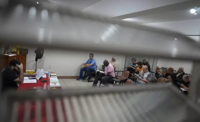 Gamblers in recovery attend a Gamblers Anonymous meeting in Sao Paulo, Monday, Oct. 21, 2024. (AP Photo/Andre Penner)