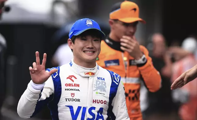 RB driver Yuki Tsunoda of Japan, celebrates his third place after the qualifying session ahead of the Brazilian Formula One Grand Prix at the Interlagos race track, in Sao Paulo, Brazil, Sunday, Nov. 3, 2024. (AP Photo/Ettore Chiereguini)