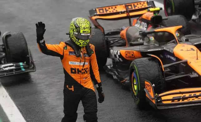 Pole position winner, McLaren driver Lando Norris of Britain, celebrates after the qualifying session ahead of the Brazilian Formula One Grand Prix at the Interlagos race track, in Sao Paulo, Brazil, Sunday, Nov. 3, 2024. (AP Photo/Andre Penner)