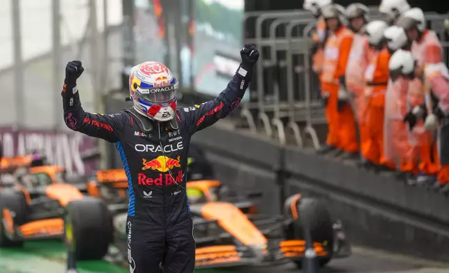 Red Bull driver Max Verstappen of the Netherlands celebrates winning the Brazilian Formula One Grand Prix at the Interlagos race track, in Sao Paulo, Brazil, Sunday, Nov. 3, 2024. (AP Photo/Andre Penner)