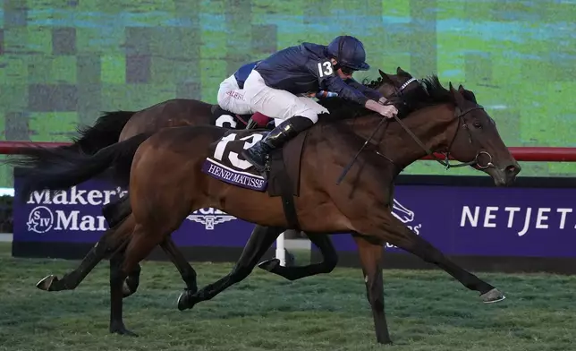 Ryan Moore rides Henri Matisse to victory in the Breeders' Cup Juvenile Turf horse race at Santa Anita Park in Del Mar, Calif., Friday, Nov. 1, 2024. (AP Photo/Gregory Bull)