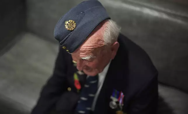 Michael Woods, 100-year-old World War II veteran, speaks during an interview in Dunstable, Bedfordshire, England, Tuesday, Nov. 5, 2024. (AP Photo/Kin Cheung)