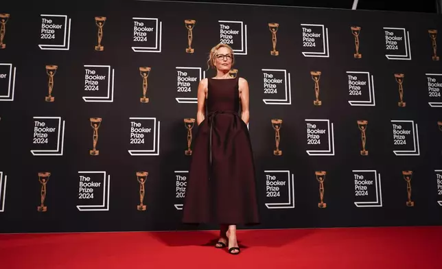 Gillian Anderson arrives at the Booker Prize award dinner in London, Tuesday, Nov. 12, 2024. (AP Photo/Alberto Pezzali)