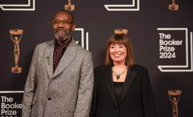 Lenny Henry, left, arrives at the Booker Prize award dinner in London, Tuesday, Nov. 12, 2024. (AP Photo/Alberto Pezzali)