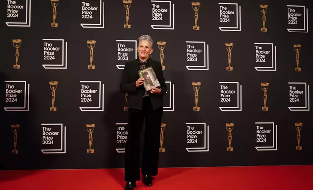 Charlotte Wood arrives at the Booker Prize award dinner in London, Tuesday, Nov. 12, 2024. (AP Photo/Alberto Pezzali)