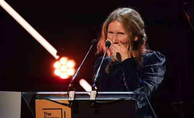 Samantha Harvey gives a speech after winning the Booker Prize award 2024, in London, Tuesday, Nov. 12, 2024. (AP Photo/Alberto Pezzali)