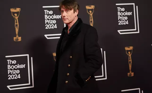 Brett Anderson arrives at the Booker Prize award dinner in London, Tuesday, Nov. 12, 2024. (AP Photo/Alberto Pezzali)