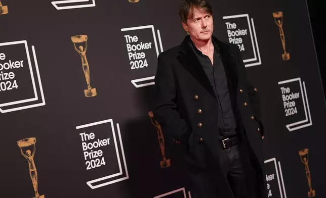 Brett Anderson arrives at the Booker Prize award dinner in London, Tuesday, Nov. 12, 2024. (AP Photo/Alberto Pezzali)