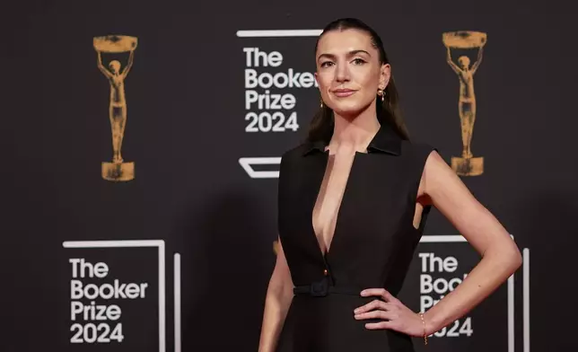 Katy Hessel arrives at the Booker Prize award dinner in London, Tuesday, Nov. 12, 2024. (AP Photo/Alberto Pezzali)