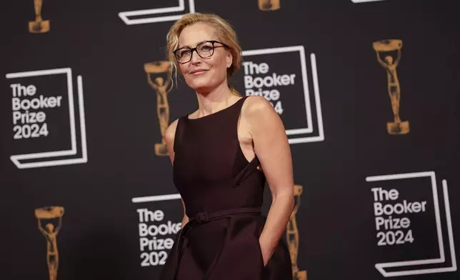 Gillian Anderson arrives at the Booker Prize award dinner in London, Tuesday, Nov. 12, 2024. (AP Photo/Alberto Pezzali)