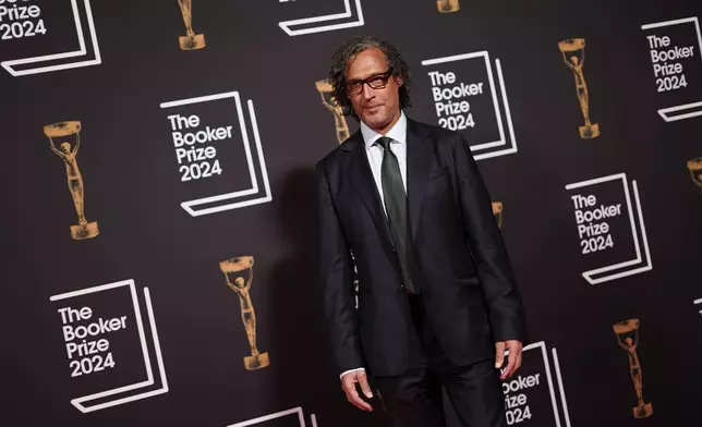 David Olusoga arrives at the Booker Prize award dinner in London, Tuesday, Nov. 12, 2024. (AP Photo/Alberto Pezzali)