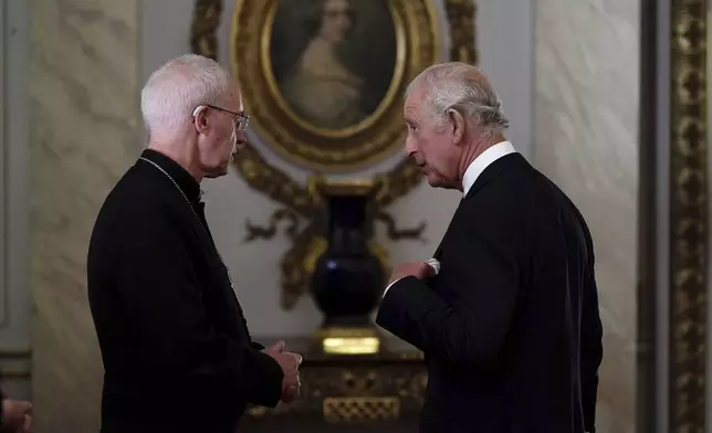 FILE - Britain's King Charles III speaks to Archbishop of Canterbury, Justin Welby, as he meets with faith leaders during a reception at Buckingham Palace, London, Friday Sept. 16, 2022. (Aaron Chown/Pool Photo via AP, File)