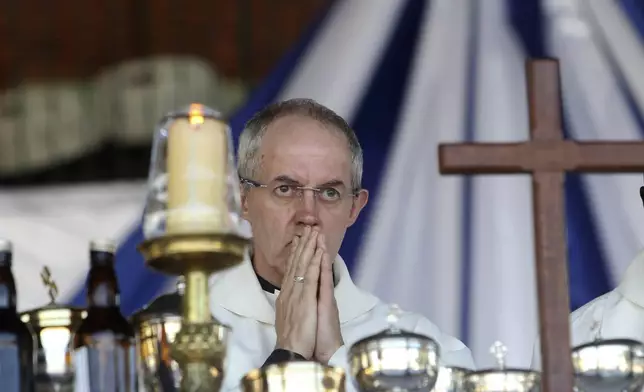 FILE - Britain's Archbishop of Canterbury, Justin Welby conducts a church service with Anglicans in Harare, Zimbabwe, Sunday, April, 17, 2016. (AP Photo/Tsvangirayi Mukwazhi, File)