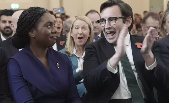 Britain's Member of Parliament Kemi Badenoch's husband Hamish applauds as she was announced as the new Conservative Party leader following the vote by party members, at 8 Northumberland Avenue in central London, Saturday Nov. 2, 2024. (Stefan Rousseau/PA via AP)