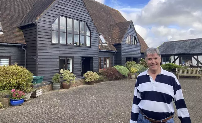 Stewart Lewis poses near his home in Abbots Langley, England, on Friday, Oct. 18, 2024. Plans to build a data center in a field on Abbots Langley's outskirts has pitted the national government's priorities against the interests of local villagers. (AP Photo/Peter Morgan)