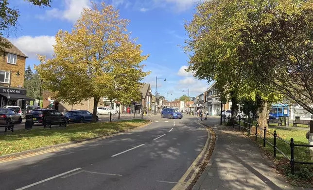 The main road in Abbots Langley, England, is shown on Friday, Oct. 18, 2024. Plans to build a data center in a field on Abbots Langley's outskirts has pitted the national government's priorities against the interests of local villagers. (AP Photo/Peter Morgan)