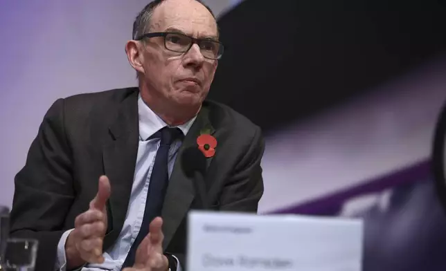 Bank of England Deputy Governor, Markets and Banking, Dave Ramsden gestures during the central bank's Monetary Policy Report press conference at the Bank of England, in London, Thursday, Nov. 7, 2024. (Henry Nicholls/Pool Photo via AP)