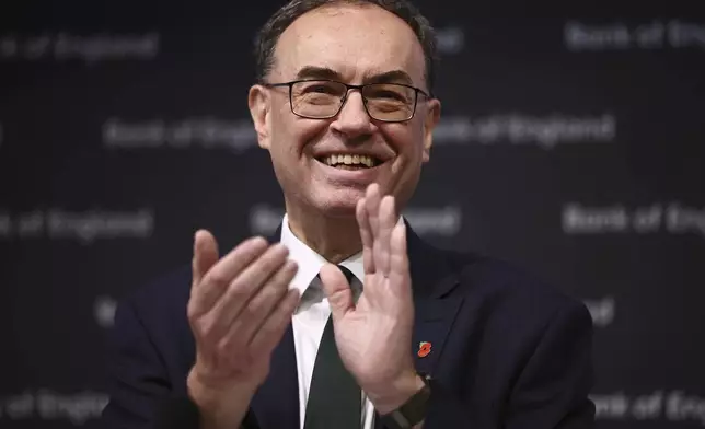 Bank of England Governor Andrew Bailey applauds during the central bank's Monetary Policy Report press conference at the Bank of England, in London, Thursday, Nov. 7, 2024. (Henry Nicholls/Pool Photo via AP)