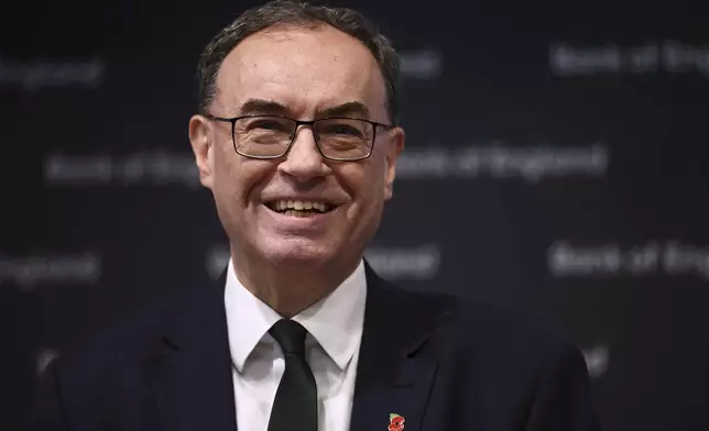 Bank of England Governor Andrew Bailey smiles during the central bank's Monetary Policy Report press conference at the Bank of England, in London, Thursday, Nov. 7, 2024. (Henry Nicholls/Pool Photo via AP)