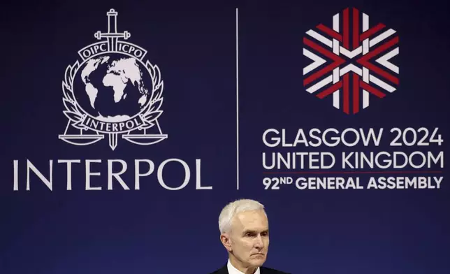 Juergen Stock Interpol secretary general speaks to the media at 92nd Interpol general assembly in Glasgow, Scotland, Monday, Nov. 4, 2024. (AP Photo/Scott Heppell)