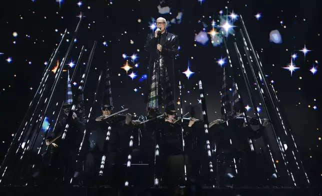 Neil Tennant from the 'Pet Shop Boys' performs alongside the Manchester Camerata during the MTV European Music Awards in Manchester, England, Sunday, Nov. 10, 2024. (Scott A Garfitt/Invision/AP)